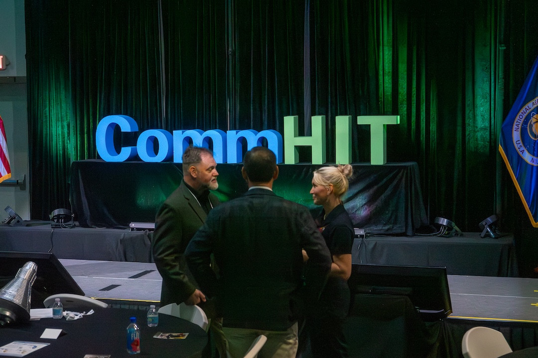 Attendees networking at CommHIT25